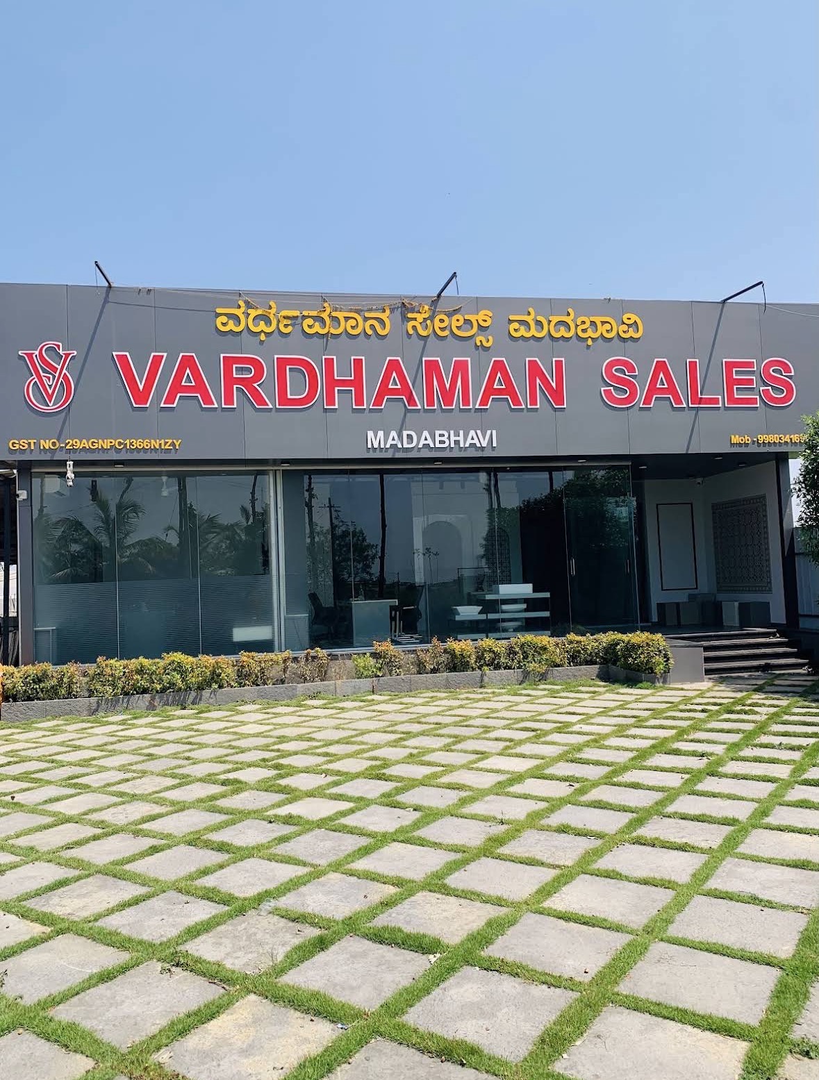 Vardhaman Sales storefront on the main road in Madabhavi